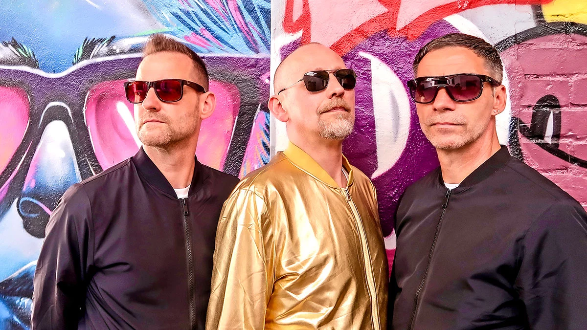 Picture of Neon Space Men - three men poses with sunglasses